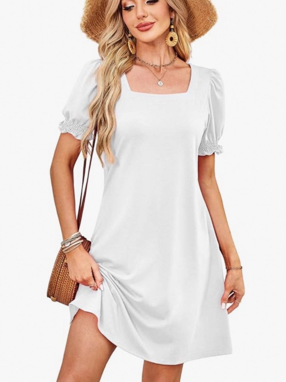 Lightweight white dress with a flattering square neckline. Puff sleeves with smo
